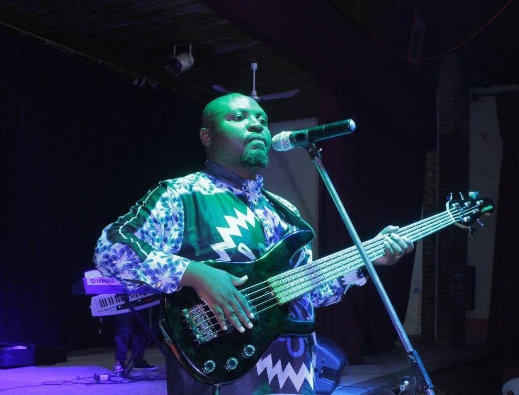 A bass guitarist playing in a worship band