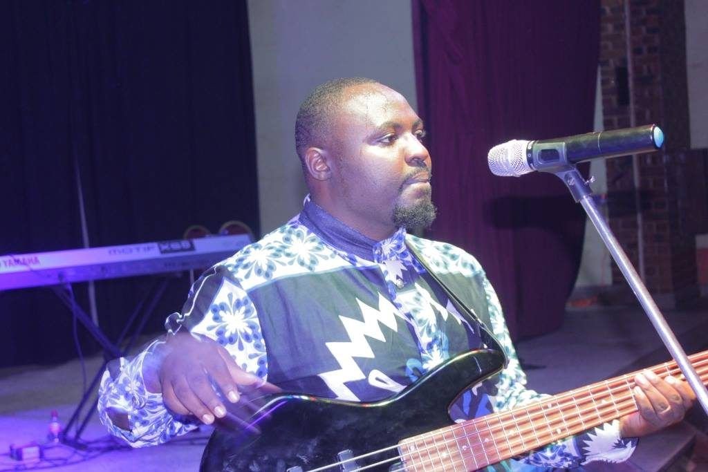 A bass player leading in worship