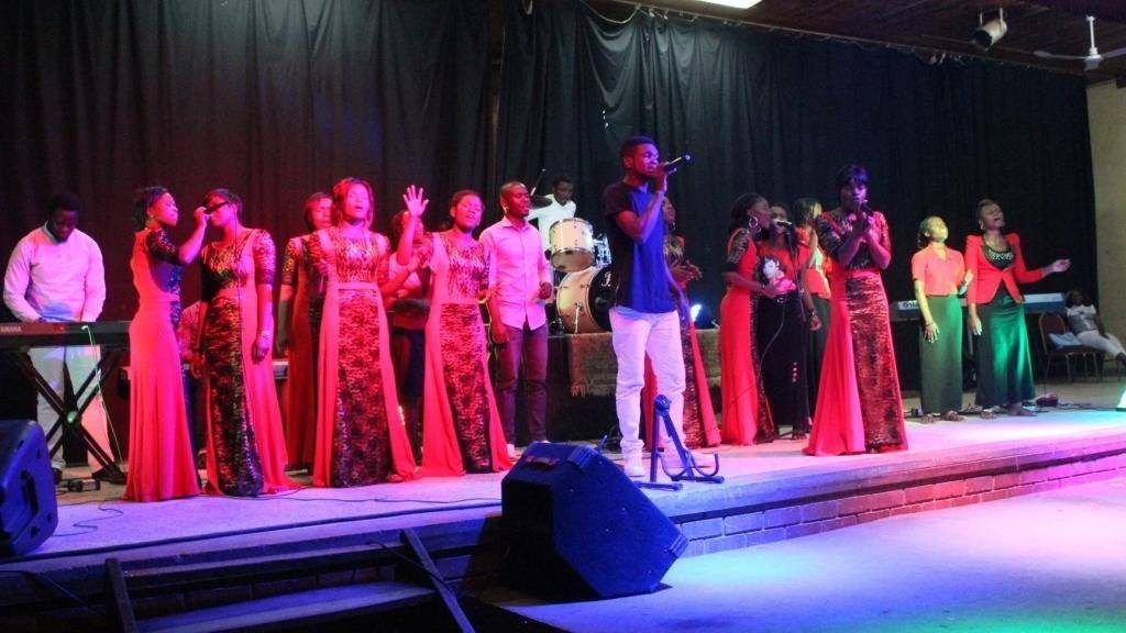 Choir in red ministering in worship