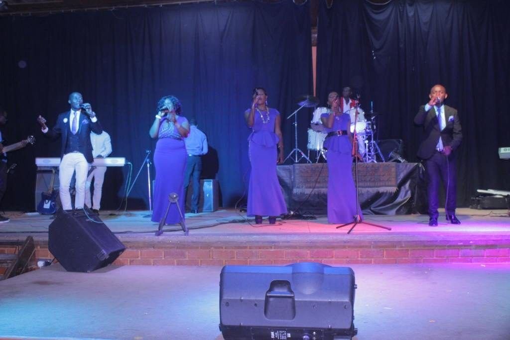 A worship team leading on stage